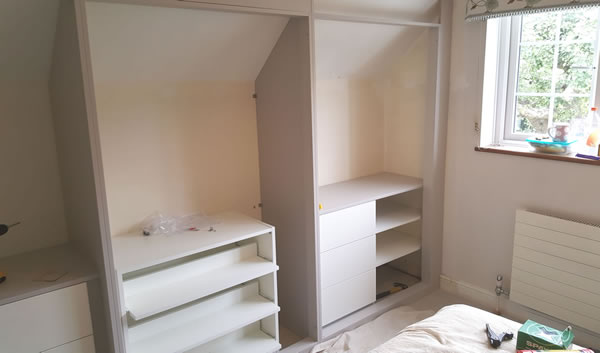  3 levels pull out double depth shoe trays and short hanging rail above with long hanging rail to the right / 3 x drawers with 3 x shelves to the right and short hanging rail above.