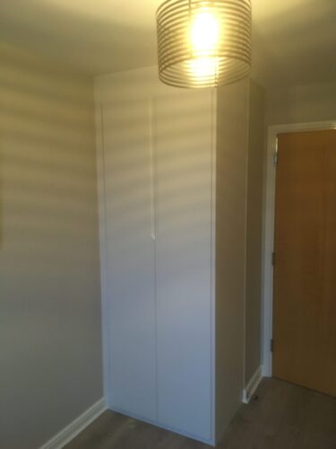 Double wardrobe in Alpine White with Integra style doors.