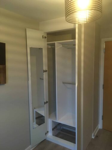 Double wardrobe in Alpine White with Integra style doors.