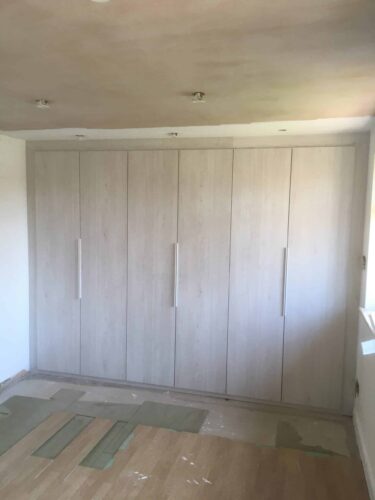 3 Hinged Double Wardrobes in White Nordic Wood with Venice style doors.