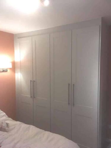 Two double hinged wardrobes.