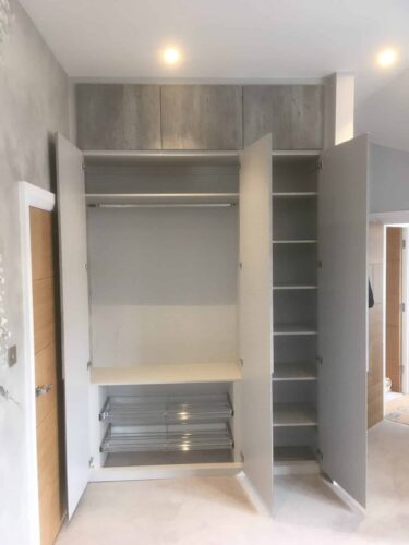 helves and Hanging Space. Wardrobes in 4 bedrooms in Light Grey with doors in London Concrete with Integra style.