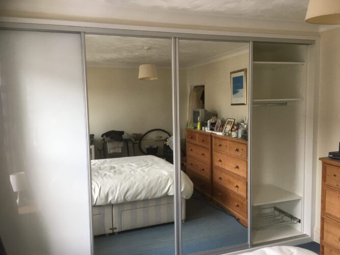 Shelves, Hanging Space and Shoe Rack. Four Sliding Door Double Wardrobes in Alpine White with 2 Pure White glass & 2 Mirror Aluminium doors.