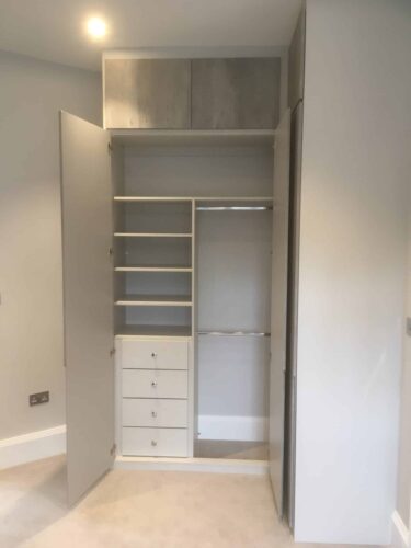 Drawers, Hanging Space and Shelf. Wardrobes in 4 bedrooms in Light Grey with doors in London Concrete with Integra style.