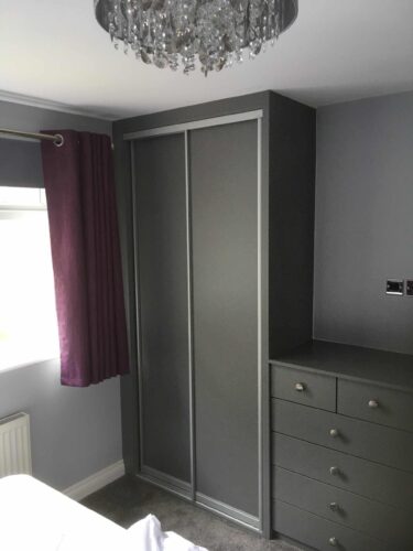 Fitted Sliding Door Wardrobe with matching chest of drawers.