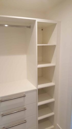 Bespoke walk in wardrobe with hanging space, chest of drawers and shelving