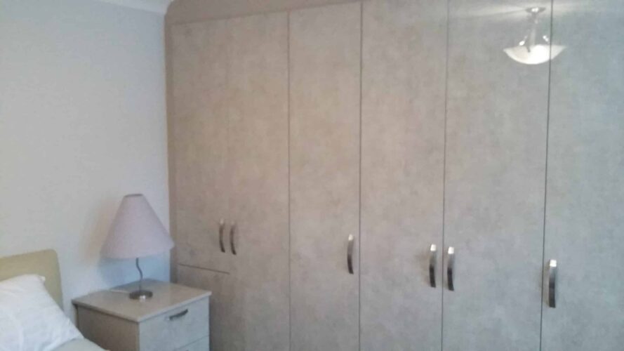 Ultragloss Limestone Wardrobe. 3 doubles & 2 singles robes.