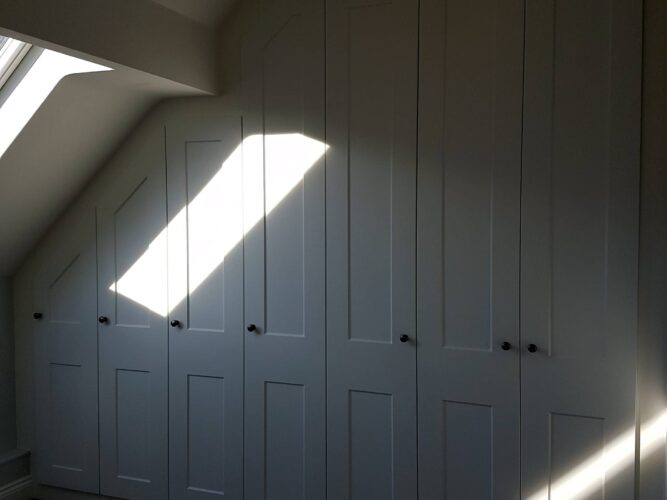 Angled wardrobes in the eaves