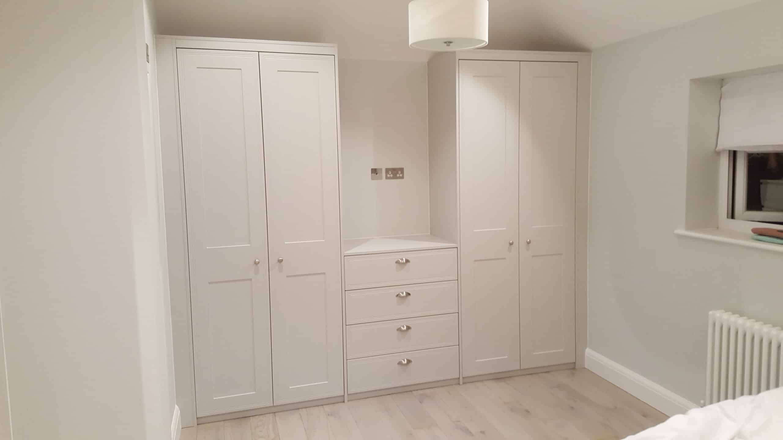 Double hinged door wardrobe with matching chest of drawers.