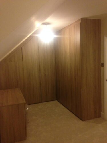 Angle Corner Wardrobe & Dressing Table. Grey Bardolino Oak - Venice style doors, dressing table above the radiator with top vents.