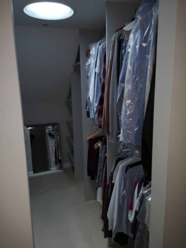 Hanging space in a walk-in wardrobe under the eaves