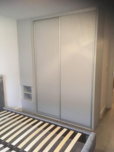 Sliding Wardrobe With Build-in Bedside. Oakgrain Grey in silver profile.