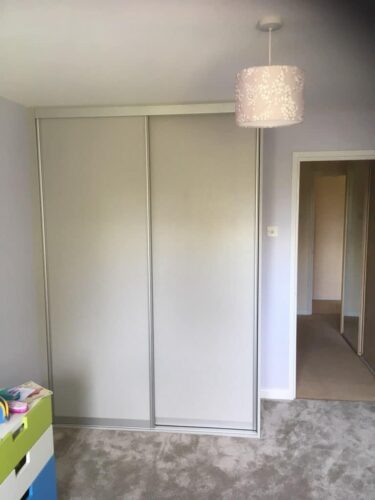 Sliding Door wardrobe in Oakgrain Grey with Silver profile.